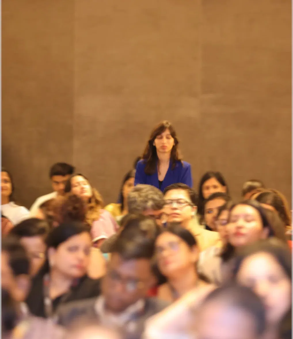 Anuradha standing in the audience at EYES 2026
