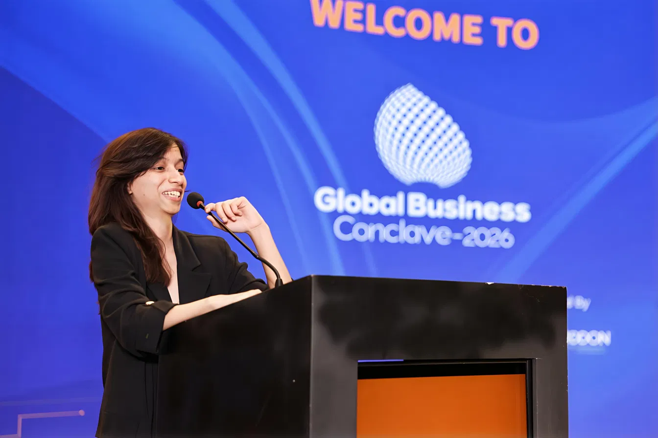 At the podium, smiling, GBC 2026