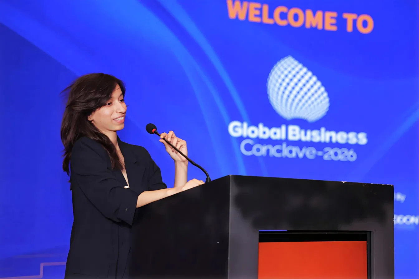 Anuradha Tibile speaking at the podium, GBC 2026