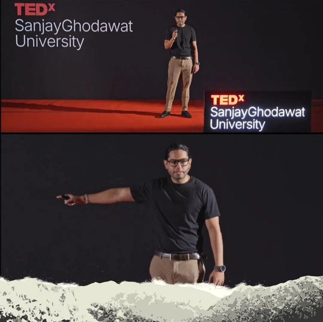 Speaker on stage pointing, TEDx SGU